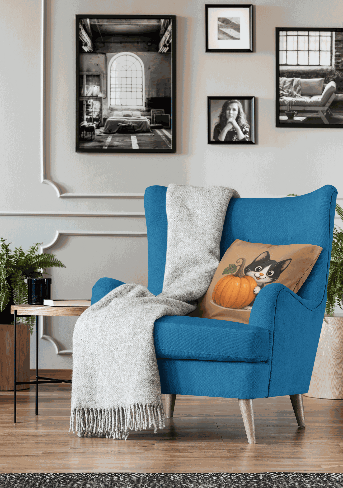 Fall Cat Pillow with playful cat and pumpkin design on cozy blue armchair with gray throw blanket in autumn-themed living room decor