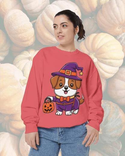 Woman wearing a red sweatshirt featuring a cute dog in a Halloween witch costume holding a pumpkin bucket against a pumpkin background, Halloween Dog Trick or Treating Sweatshirt design.