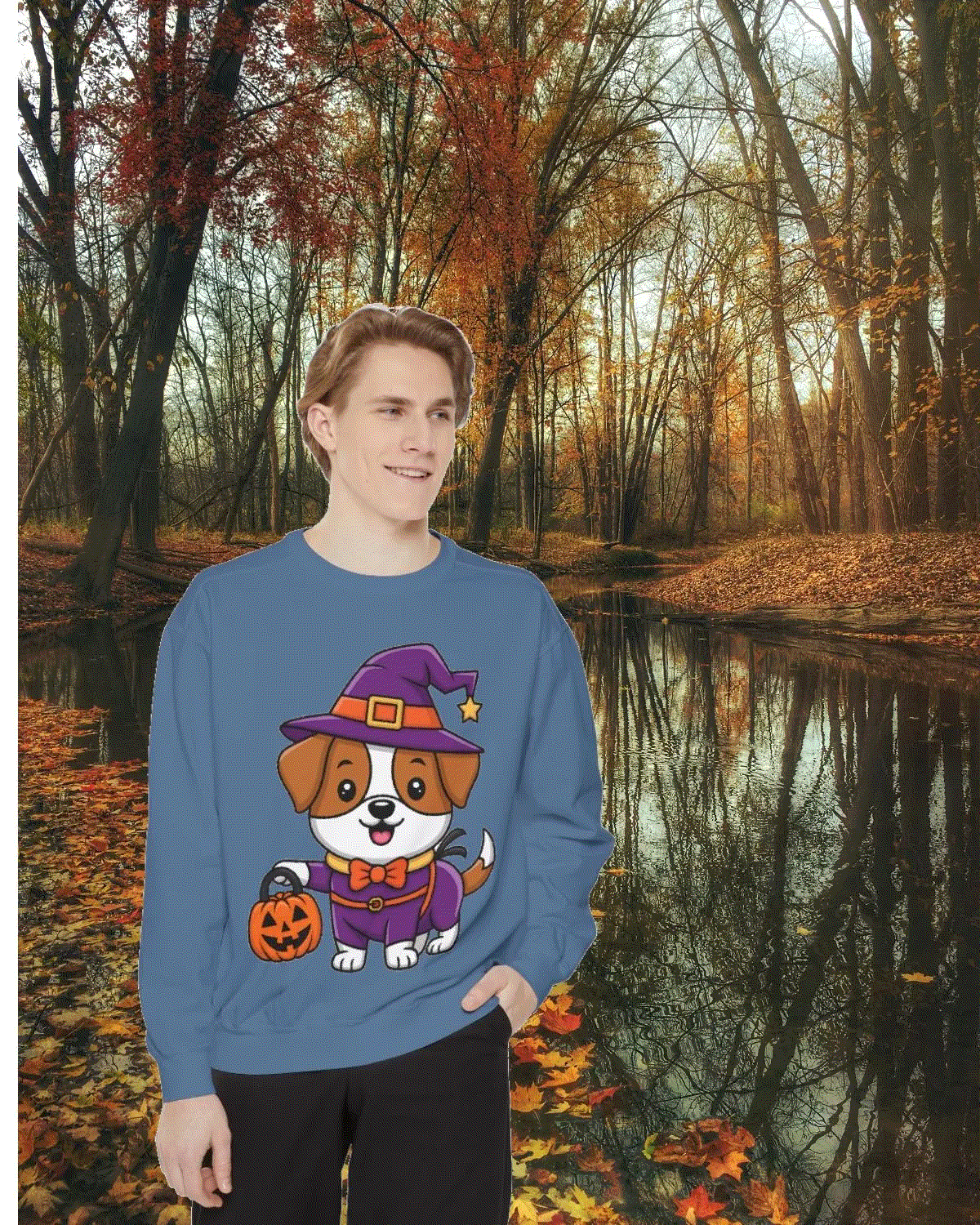 Man wearing blue sweatshirt with cute Halloween dog trick or treating design in autumn forest setting