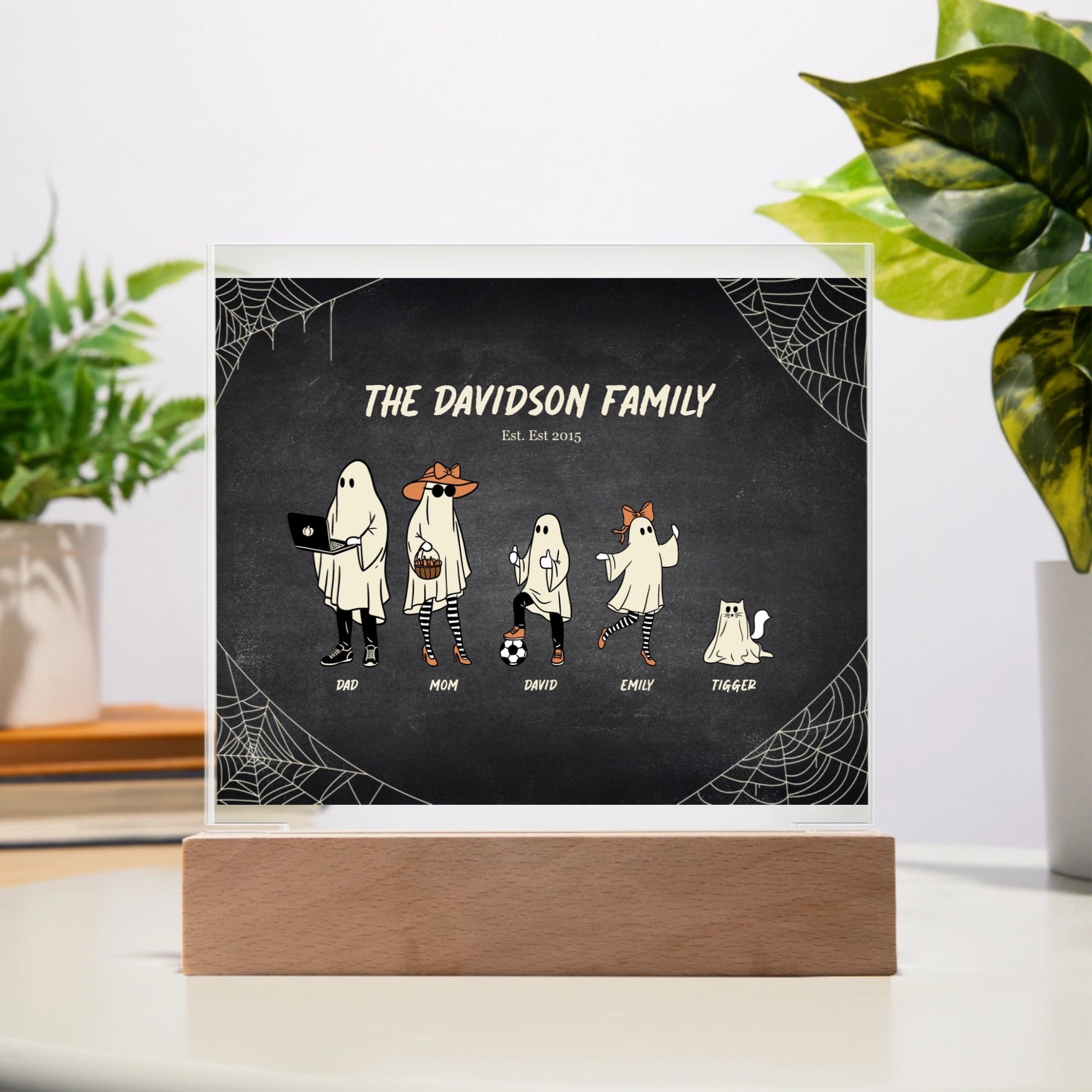 Spooky Halloween Family acrylic plaque with personalized ghost characters and LED wooden base on table