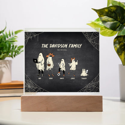 Spooky Halloween Family acrylic plaque with personalized ghost characters and LED wooden base on table