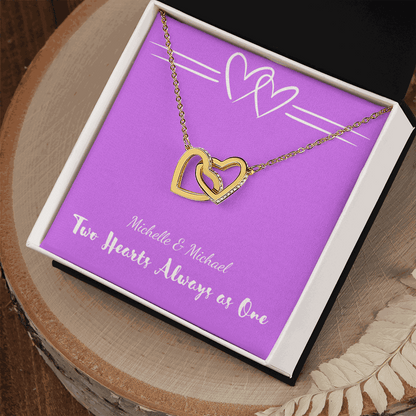 Interlocking Hearts necklace with two gold heart pendants in gift box