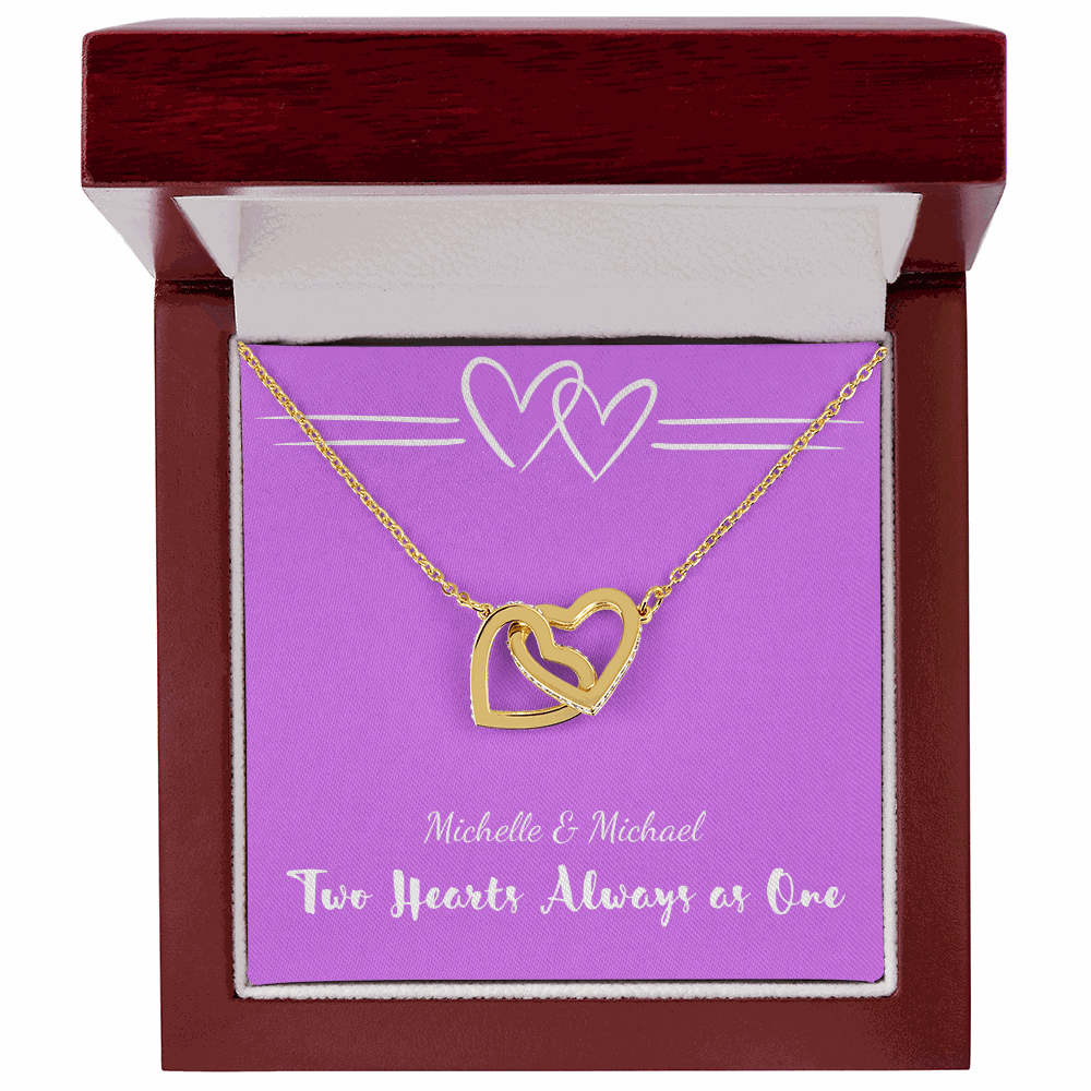 Gold interlocking hearts necklace in mahogany gift box with purple card reading Two Hearts Always as One