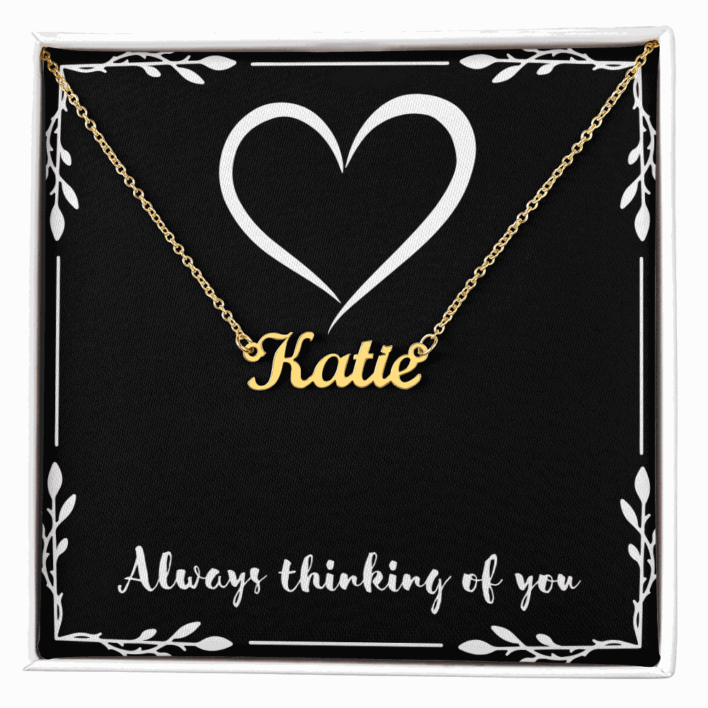 Custom gold name necklace with "Katie" pendant in gift box featuring heart design and "Always thinking of you" message