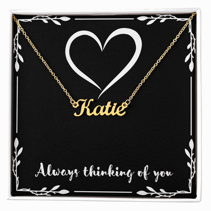 Custom gold name necklace with "Katie" pendant in gift box featuring heart design and "Always thinking of you" message