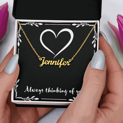 Custom name necklace with gold cursive "Jennifer" on adjustable chain in gift box with heart design