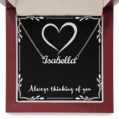 Custom name necklace with "Isabella" in cursive on adjustable silver chain in gift box with heart design and "Always thinking of you" text