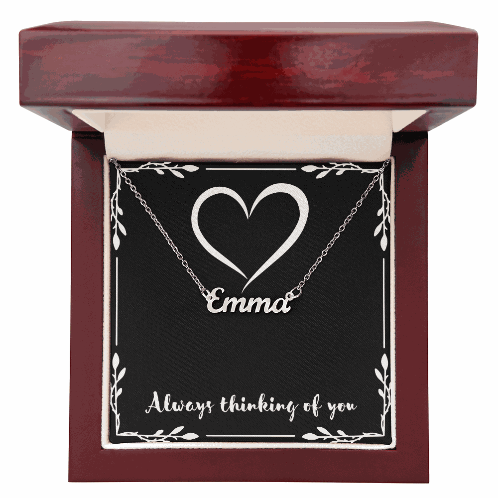 Custom Name Necklace with Emma pendant in cursive style displayed in a mahogany gift box with heart design and "Always thinking of you" message
