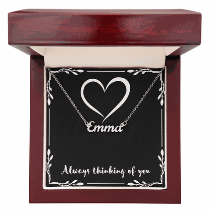 Custom Name Necklace with Emma pendant in cursive style displayed in a mahogany gift box with heart design and "Always thinking of you" message