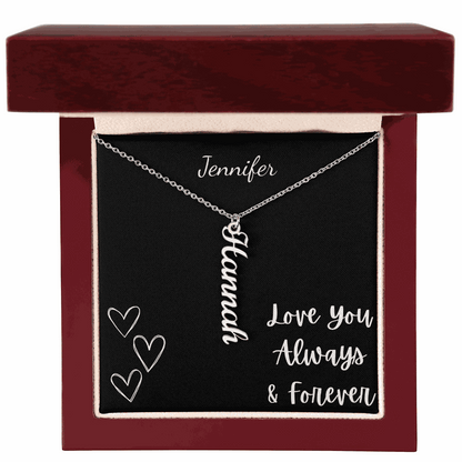 Personalized vertical name necklace with "Hannah" in cursive on silver chain in a gift box with love message