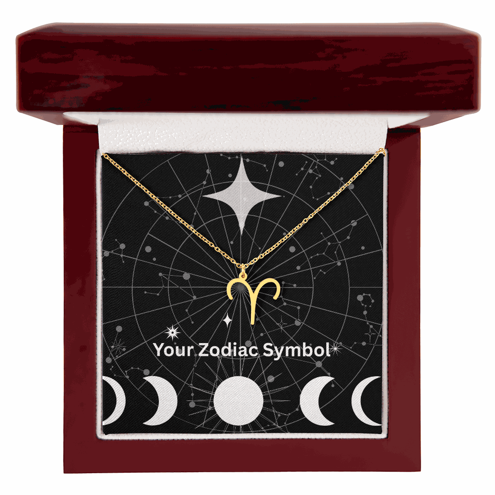 Gold zodiac symbol necklace in mahogany luxury gift box with constellation background