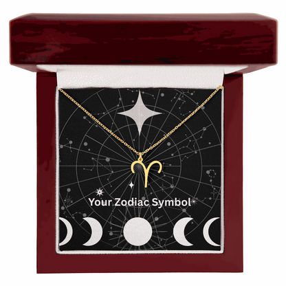 Gold zodiac symbol necklace in mahogany luxury gift box with constellation background