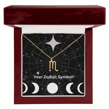 Gold Zodiac Symbol Necklace in luxury mahogany gift box with constellation background