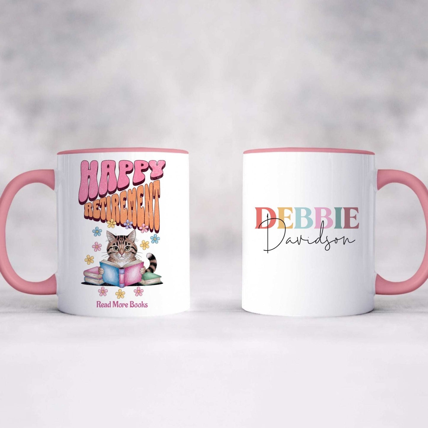 Personalized Happy Retirement Mug with cat and books design on one side and custom name on the other, pink handle and rim