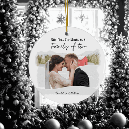 Personalized First Christmas Family Ornament with couple photo and custom names hanging on decorated Christmas tree.